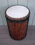 A dundunba that needs one of its cow skin drum heads replaced.