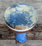 A clay doumbek with a die dyed drum head newly mounted.