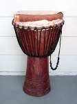 African djembe drum with broken drum head.