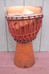 Djembe hand drum with a torn skin.
