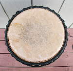 Cow skin drum head of an ashiko.