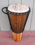 An ashiko hand drum with a fresh goat skin drum head.