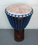 Djembe hand drum with a fresh goatskin drumhead and new rope.