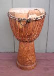 African djembe hand drum that needs to be reheaded.