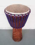 Djembe that's been re-skinned using new rings and rope.