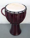 Djembe with a fresh goat skin drum head, new rings and all new rope.