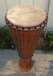 An ashiko hand drum with a fesh African goat skin and new rope.