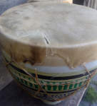 A close up of a torn skin on Moroccan bongos.