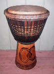 African djembe with a ripped out drum head.