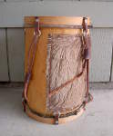 The tuning strap of a bombo drum has snapped.