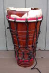 An ashiko drum with a damaged drum head.