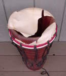 An ashiko drum head badly torn.