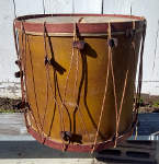 Large antique bass drum in need of repair.