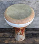 Doumbek with a stoneware shell and skirted fish skin drum head.