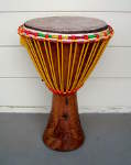 A djembe with new rope and a fresh goat skin drumhead.