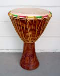 A jembe hand drum that needs to have its head replaced.