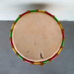 A djembe drum head with tear.