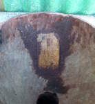 A broken djembe shell glued and patched from the inside.
