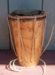 Garifuna drum from Belize with broken skin and rope.