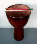 Djembe hand drum with a damaged skin and bad rope.