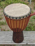 Djembe made of African hardwood, African goat skin, custom rings and high grade rope.