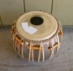 Tabla duggi with a pudi that needs to be replaced.