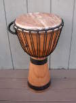 Djembe hand drum sporting new rings and a fresh African goat skin drum head.