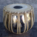Perfectly fine tabla bayan except for the syahi on the drumhead.