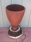 African djembe with a missing drum head.