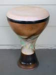 A ceramic doumbek with a new goatskin.