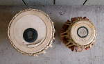 Old and damaged tabla drum heads.
