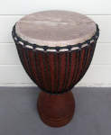 Restored djembe with new rope and fresh African goat skin.