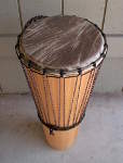 A new African goat skin drum head on an ashiko.