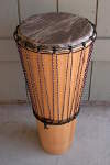 An ashiko hand drum with a fresh African goatskin drumhead.