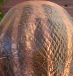 A dent on the shell of a tabla bayan.