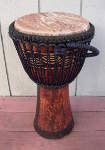 African djembe hand drum with a fresh goatskin drumhead.