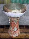 Ceramic sombaty with damaged fish skin drum head.