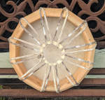 The back of a hoop drum with new rawhide lacing and counter ring.