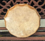 Newly repaired buffalo skin hoop drum.