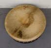 Aged and worn drumhead on bodhran drum.