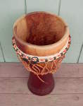 Djembe from Africa with a torn drum head.