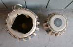 A tabla set with damaged pudis on both drums.