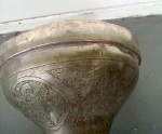 Dents on the shell of a Syrian darbuka.