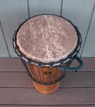 An ashiko hand drum with a fresh African goat skin drum head.