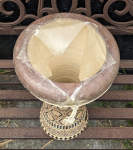 A clay doumbek with a torn fish skin drum head.