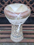 A ceramic darbuka from the Middle East with a torn fish skin.