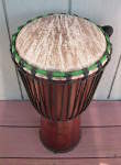 Stave djembe sporting a new goat skin drum head.