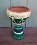 A ceramic doumbek ripped drum head.