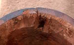 Gouge and crack on the bearing edge of a dayan's shell.