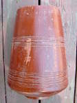 A long crack on the shell of a tabla dayan.